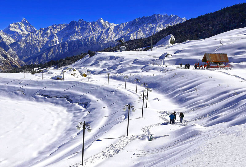 Auli skiing slopes with Himalayan peaks in the background